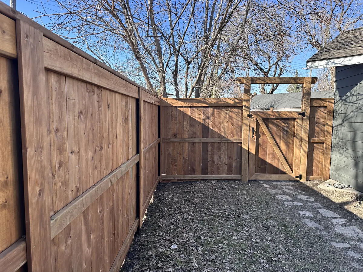 STEELROOTS wood privacy fence around a back yard
